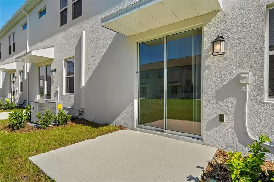 Exterior details and patio area of a home in , Davenport (Image 3).