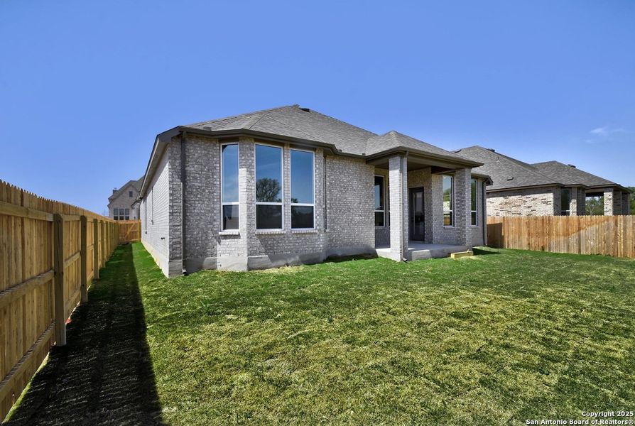 Front exterior of a new home in Alsatian Oaks: 60ft. lots, Castroville, TX, highlighting curb appeal (Image 22).