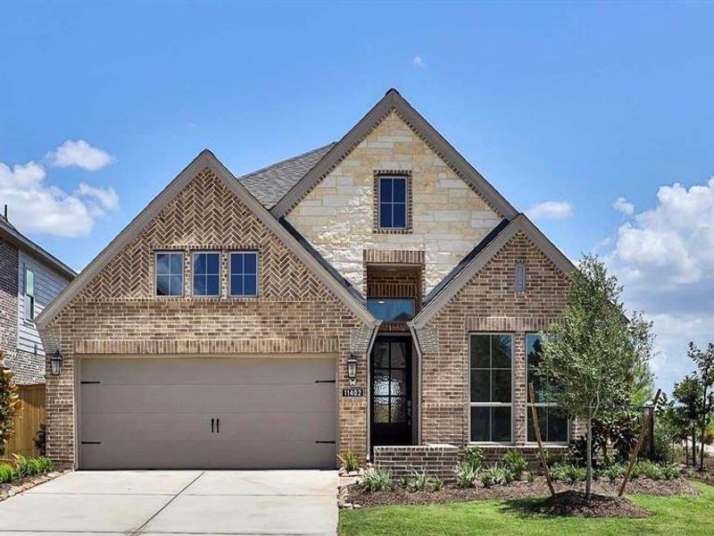 Front exterior of a new home in Bridgeland 45', Cypress, TX, highlighting curb appeal (Image 1).