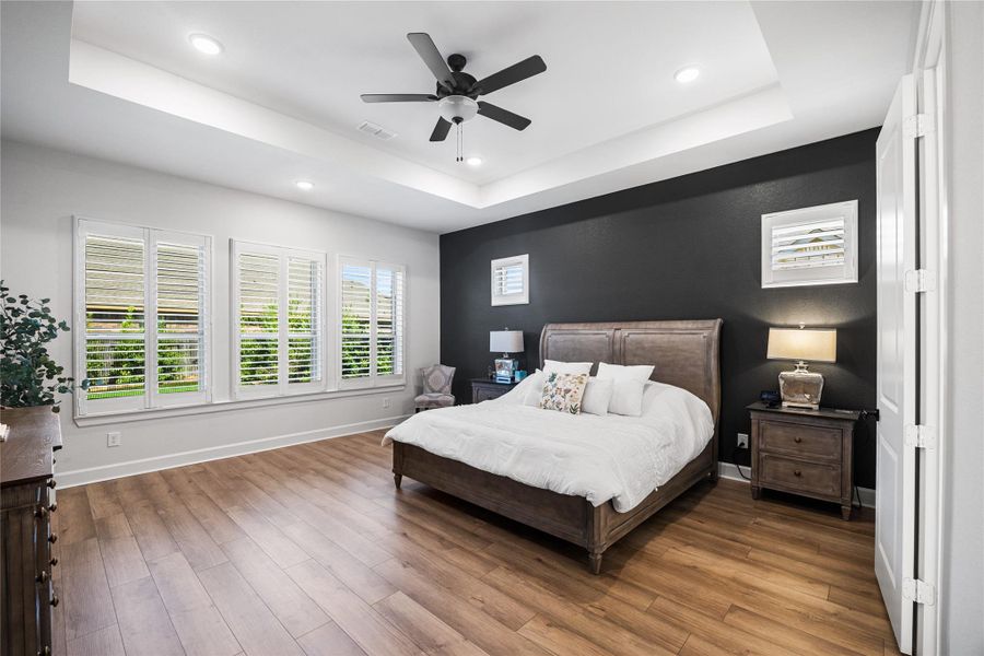 Well-appointed laundry room with built-in cabinetry, a convenient drop-off area, and dedicated folding space.