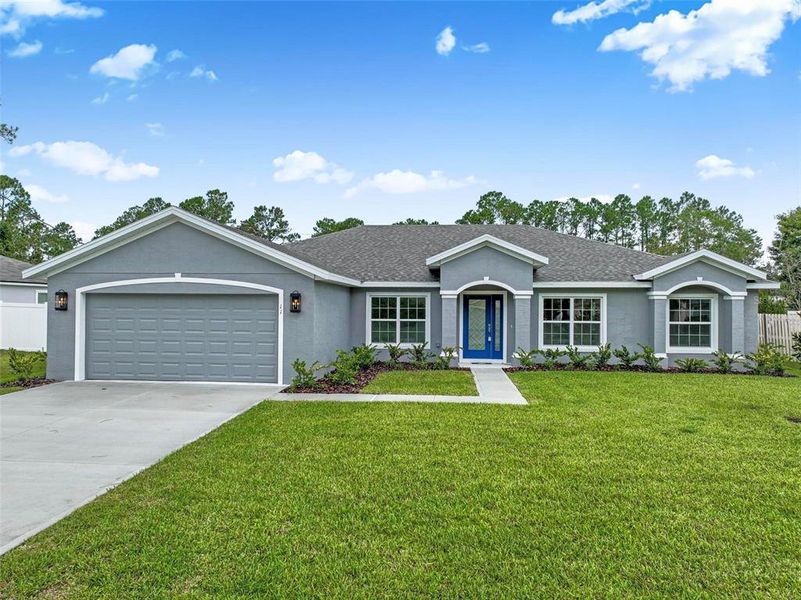 Front exterior of a new home in , Palm Coast, FL, highlighting curb appeal (Image 26).