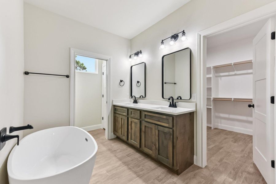 Dual vanities, private water closet and soaking tub Dual vanities, private water closet and soaking tub