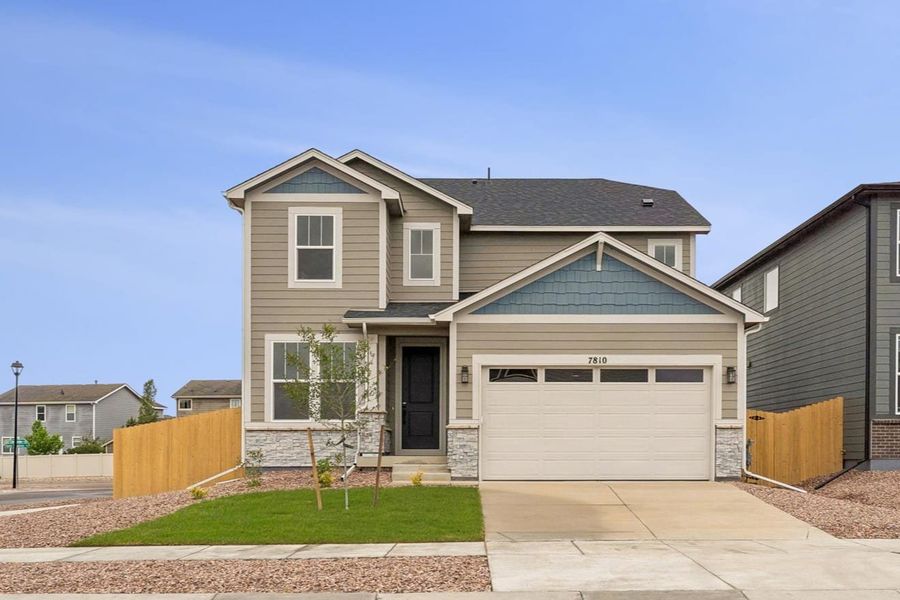 Front exterior of a new home in Aspen Meadows, Colorado Springs, CO, highlighting curb appeal (Image 1). Front exterior of a new home in Aspen Meadows, Colorado Springs, CO, highlighting curb appeal (Image 1).
