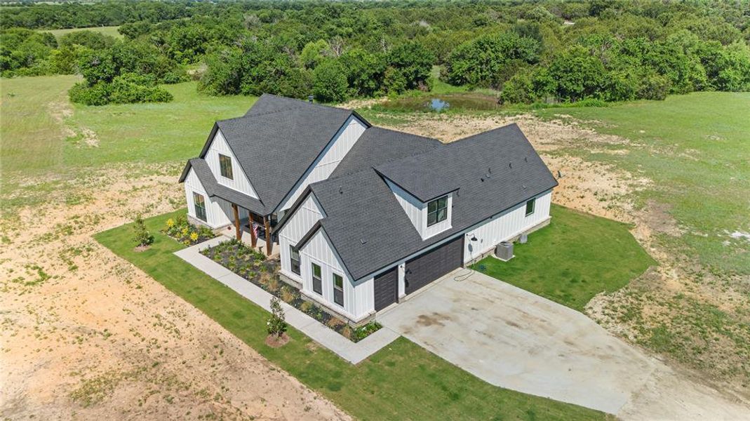 Front exterior of a new home in , Rio Vista, TX, highlighting curb appeal (Image 20).
