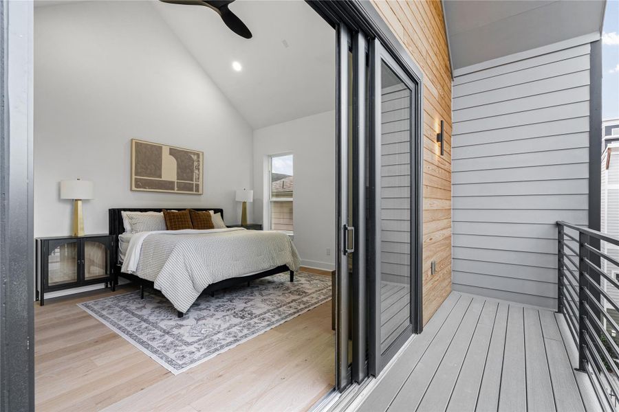 Minimalism meets comfort in this light-filled bedroom, defined by clean geometry, warm wood floors, and a seamless connection to the outdoors. Every detail is intentional, creating a space that feels both curated and effortlessly livable.