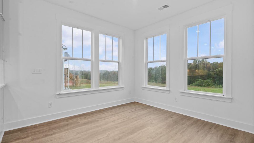 This eye-catching breakfast area provides a comfortable and stylish setting for daily meals.