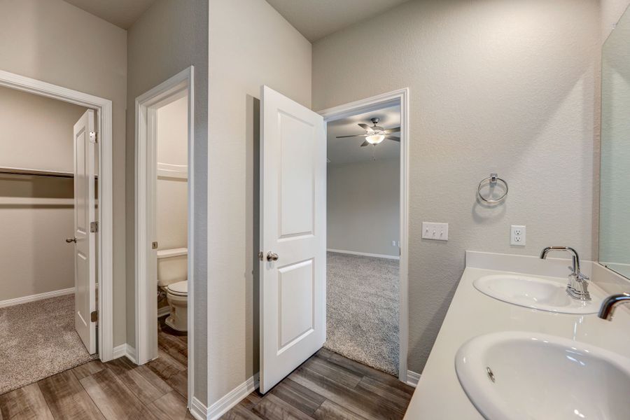 Unwind in luxury at the end of the day in this primary bathroom.