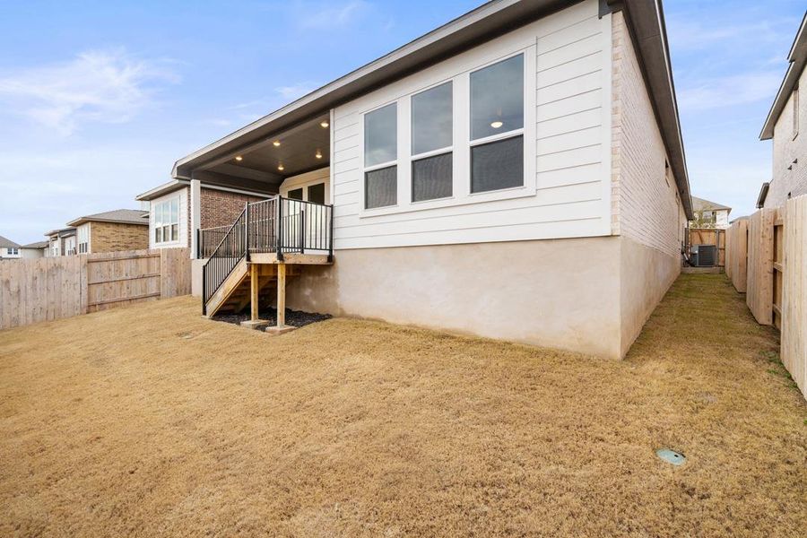 Front exterior of a new home in Park Collection at Lariat, Liberty Hill, TX, highlighting curb appeal (Image 2). Front exterior of a new home in Park Collection at Lariat, Liberty Hill, TX, highlighting curb appeal (Image 2).