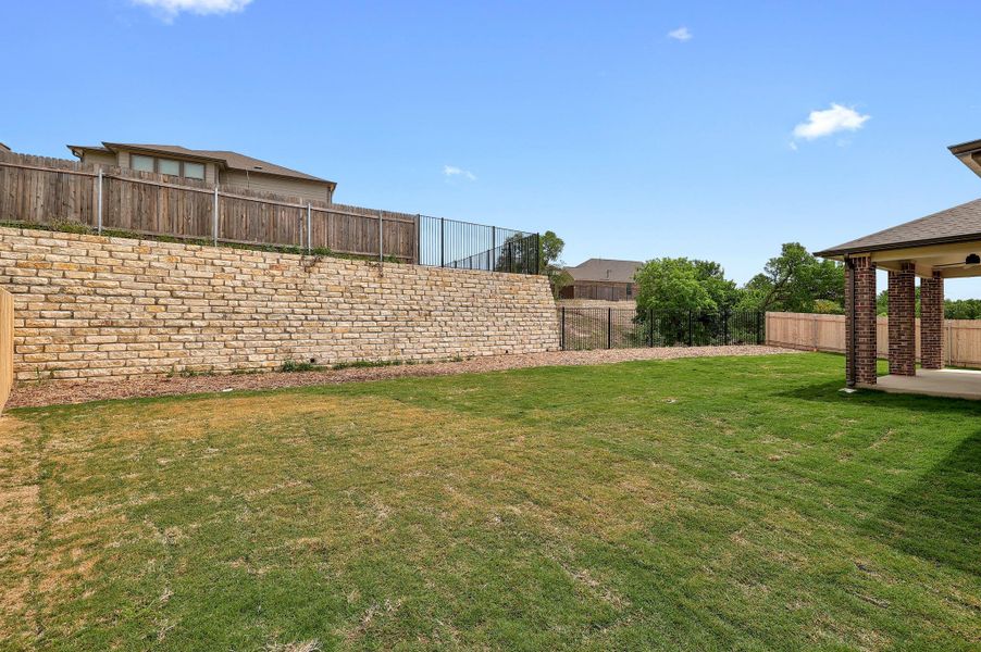 Exterior details and patio area of a home in River Bluff, Leander (Image 4).