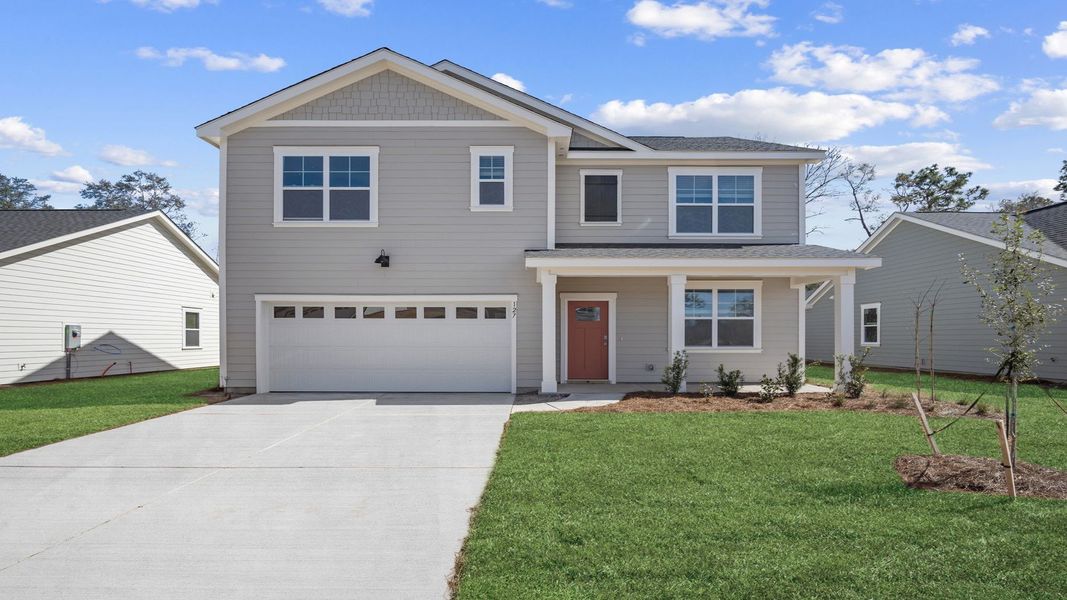Front exterior of a new home in Laurel Grove, Guyton, GA, highlighting curb appeal (Image 1).