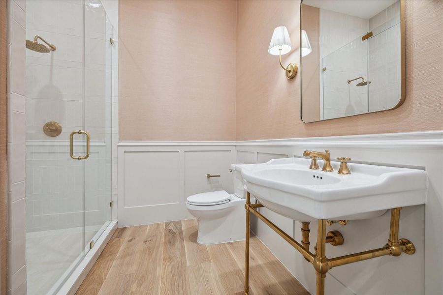 Downstairs powder bathroom with full shower. Downstairs powder bathroom with full shower.