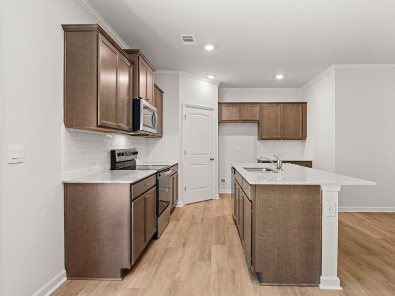 Furnished interior view inside a new home in Falcon Landing Townhomes, Gainesville (Image 6).