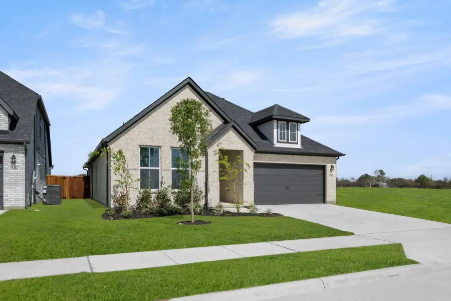 Representative exterior photo of a completed home built from the Liberty by Rockwell Homes in Wildflower Ranch, Justin, TX (Image 2).