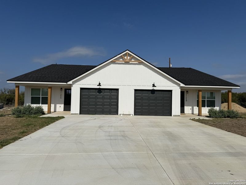 Front exterior of a new home in , Three Rivers, TX, highlighting curb appeal (Image 1).