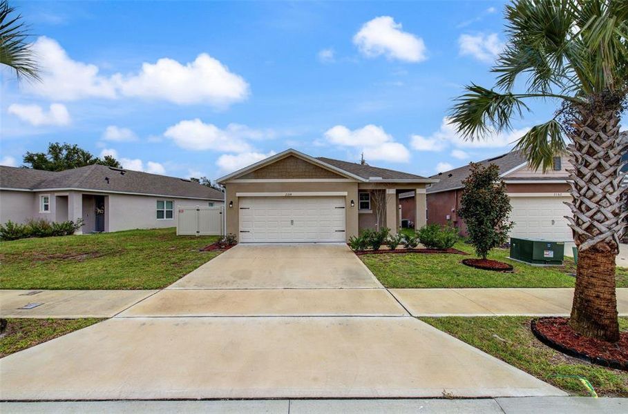 Front exterior of a new home in Cadence at Parc Hill, Orange City, FL, highlighting curb appeal (Image 1). Front exterior of a new home in Cadence at Parc Hill, Orange City, FL, highlighting curb appeal (Image 1).