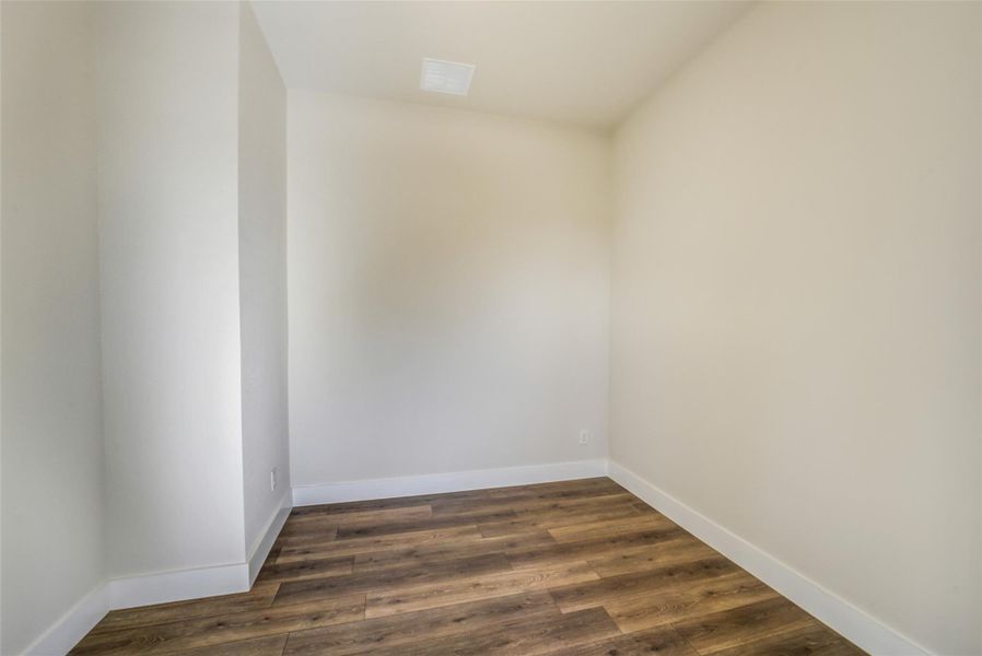 Spacious, unfurnished interior of a new home in Sunterra, Katy (Image 40).