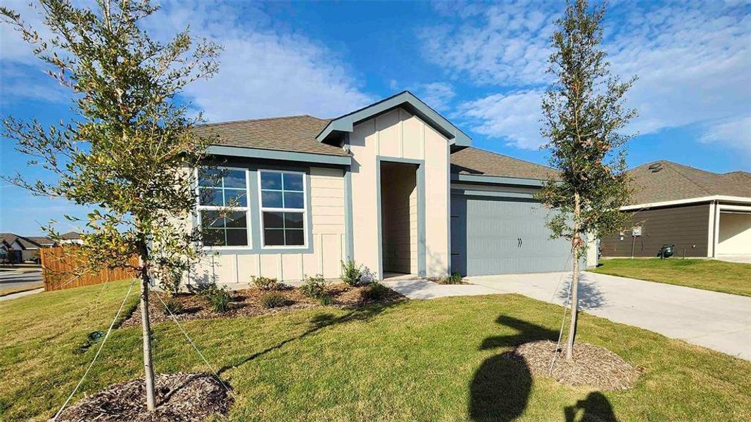 Front exterior of a new home in Waverly Estates, Josephine, TX, highlighting curb appeal (Image 1).