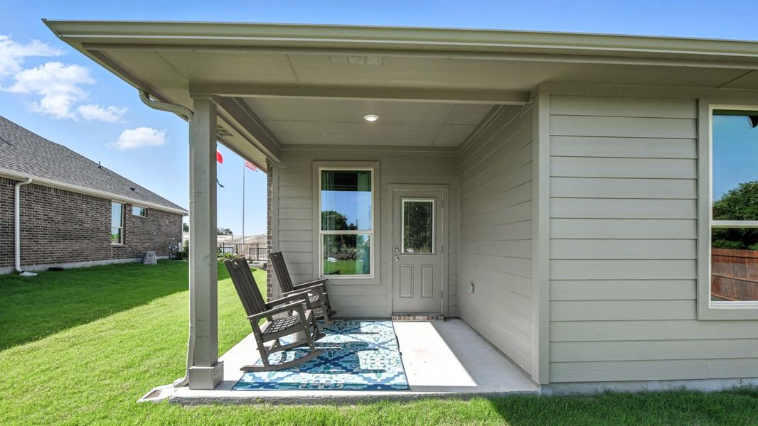 Exterior details and patio area of a home in Monarch at the Meadows, Krum (Image 2).