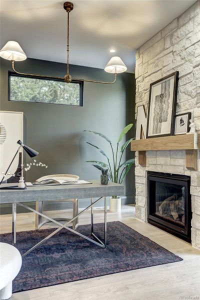 Main floor home office with a gas fireplace