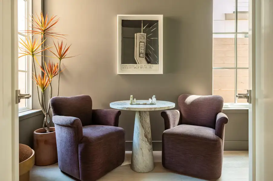 Multi-pane windows flank this cozy nook, illuminating the light hardwood flooring. Multi-pane windows flank this cozy nook, illuminating the light hardwood flooring.