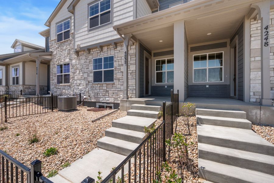 Exterior details and patio area of a home in The Lakes at Centerra, Loveland (Image 2).