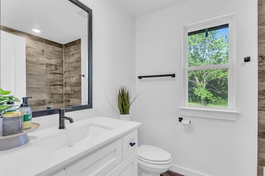 Bathroom with vanity and toilet