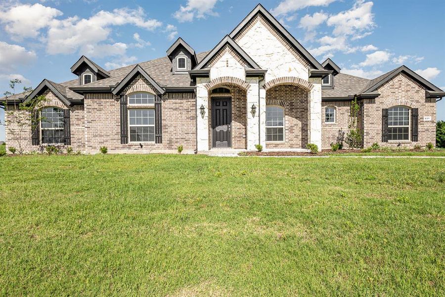 Front exterior of a new home in , Waxahachie, TX, highlighting curb appeal (Image 19).