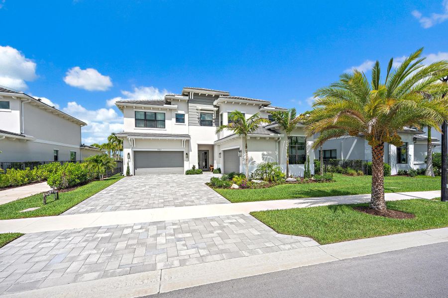 Upgraded pavers and separate two-car garages.