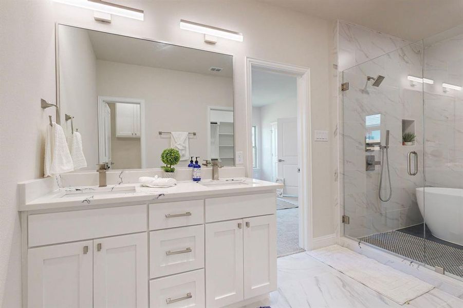 Main Bathroom featuring walk in shower, large vanity, double sink, and tile floors