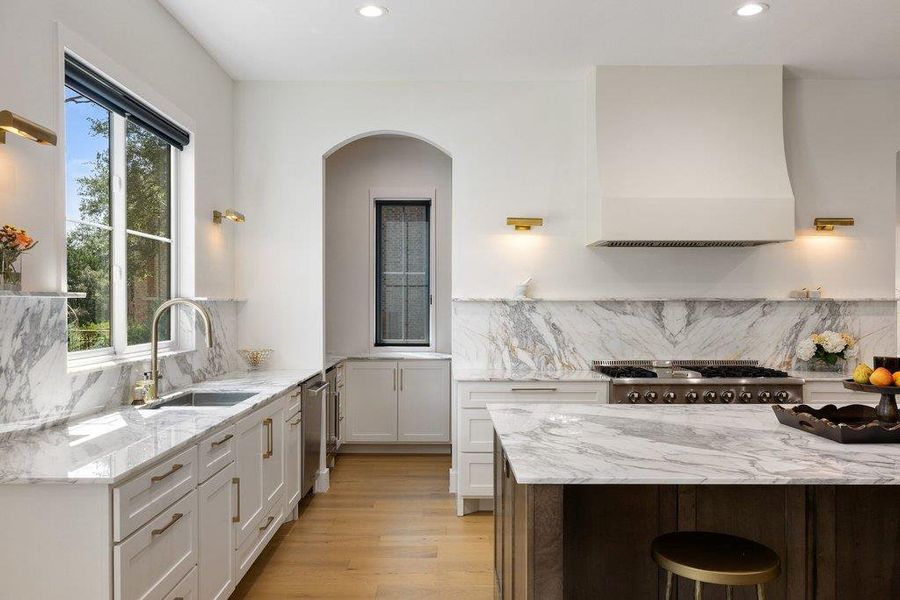 Culinary aspirations come alive in this kitchen, featuring luxurious marble countertops and gleaming stainless steel appliances. Culinary aspirations come alive in this kitchen, featuring luxurious marble countertops and gleaming stainless steel appliances.