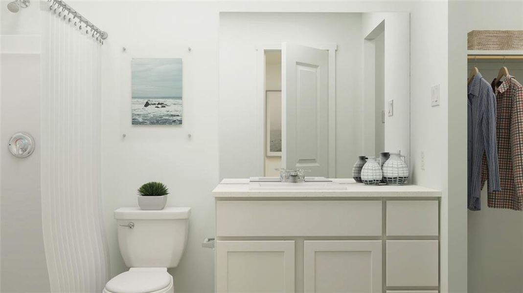 Bathroom with vanity and toilet