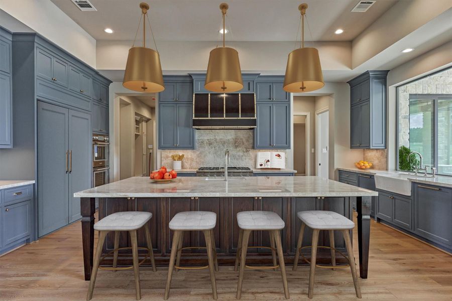 Stylish chef's kitchen, Thermador Professional Series stainless steel appliances, quartz countertops, massive island, appliance wall, vegetable sink, walk-in pantry/dirty kitchen, large window over sink and accent lighting. Photo is virtually staged/enhanced. Stylish chef's kitchen, Thermador Professional Series stainless steel appliances, quartz countertops, massive island, appliance wall, vegetable sink, walk-in pantry/dirty kitchen, large window over sink and accent lighting. Photo is virtually staged/enhanced.