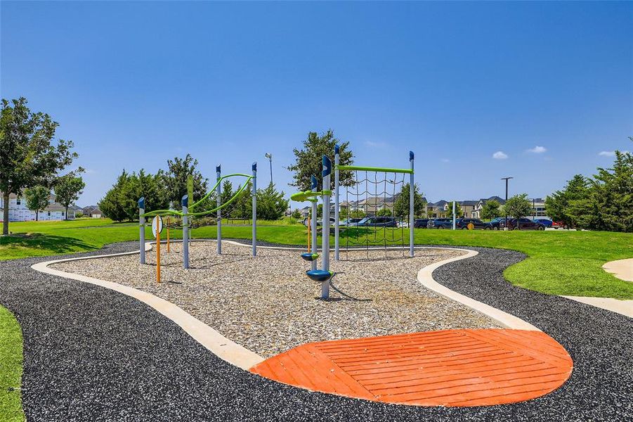 Community playground featuring a lawn