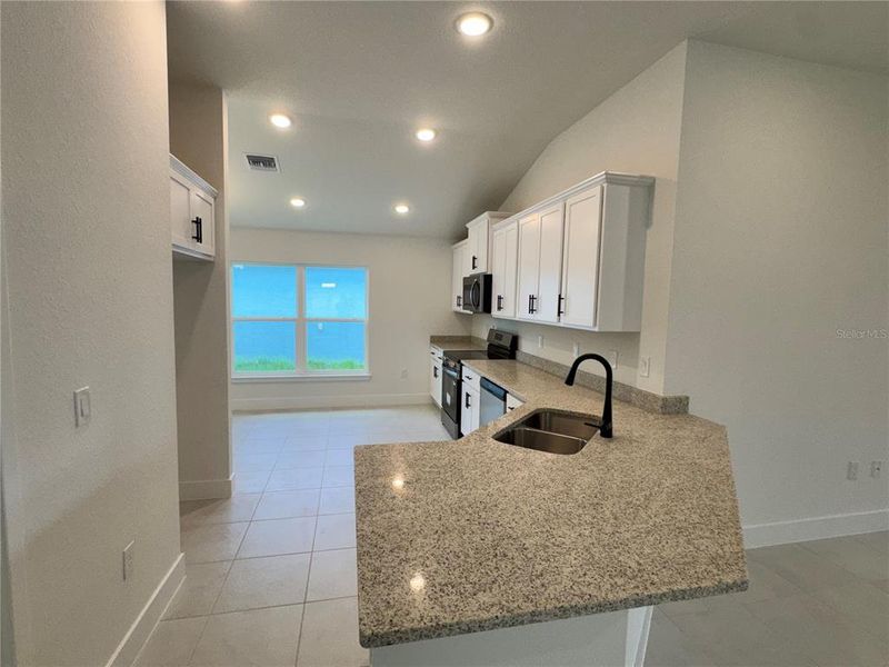Furnished interior view inside a new home in Watercress Cove, North Port (Image 3).