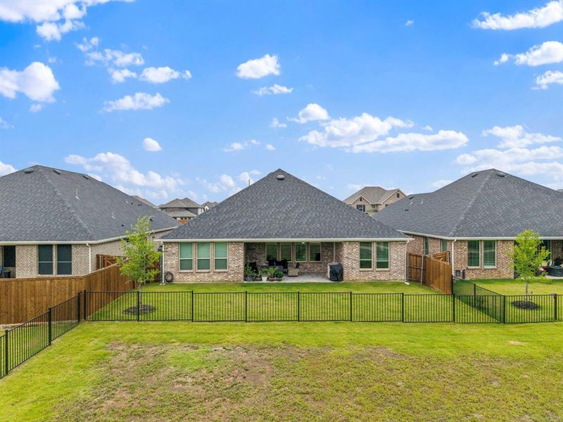 Exterior details and patio area of a home in Valencia On The Lake, Little Elm (Image 27). Exterior details and patio area of a home in Valencia On The Lake, Little Elm (Image 27).