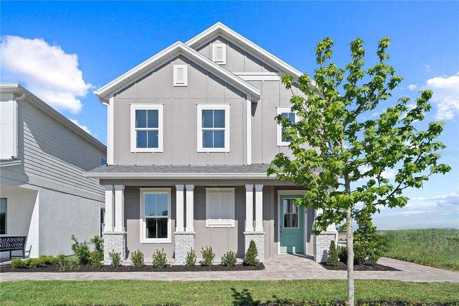 Front exterior of a new home in Trinity Place, St. Cloud, FL, highlighting curb appeal (Image 25).