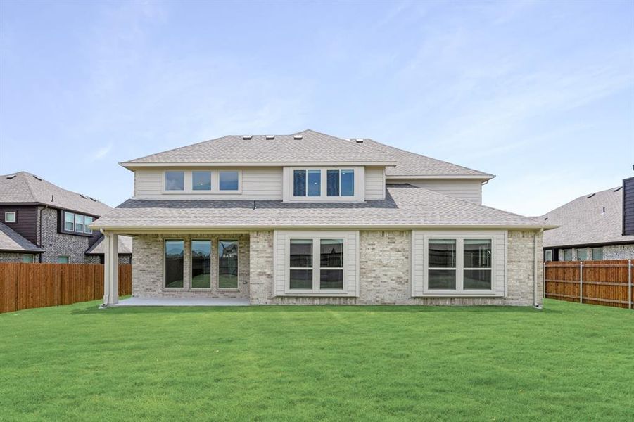 Front exterior of a new home in Sunrise at Garden Valley 60-79, Waxahachie, TX, highlighting curb appeal (Image 2). Front exterior of a new home in Sunrise at Garden Valley 60-79, Waxahachie, TX, highlighting curb appeal (Image 2).