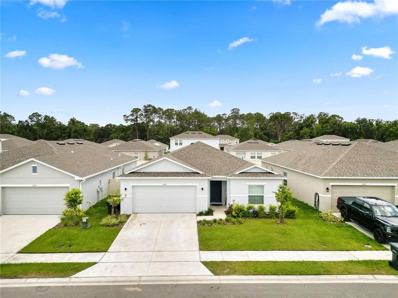 Front exterior of a new home in Ironwood, Lakeland, FL, highlighting curb appeal (Image 18).