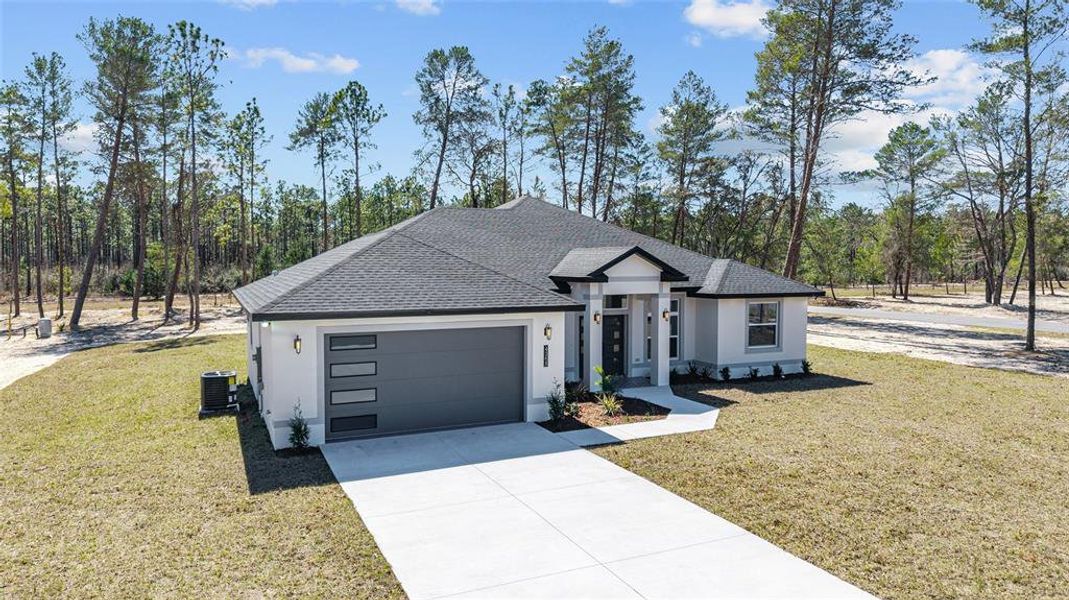 Front exterior of a new home in , Ocala, FL, highlighting curb appeal (Image 27).