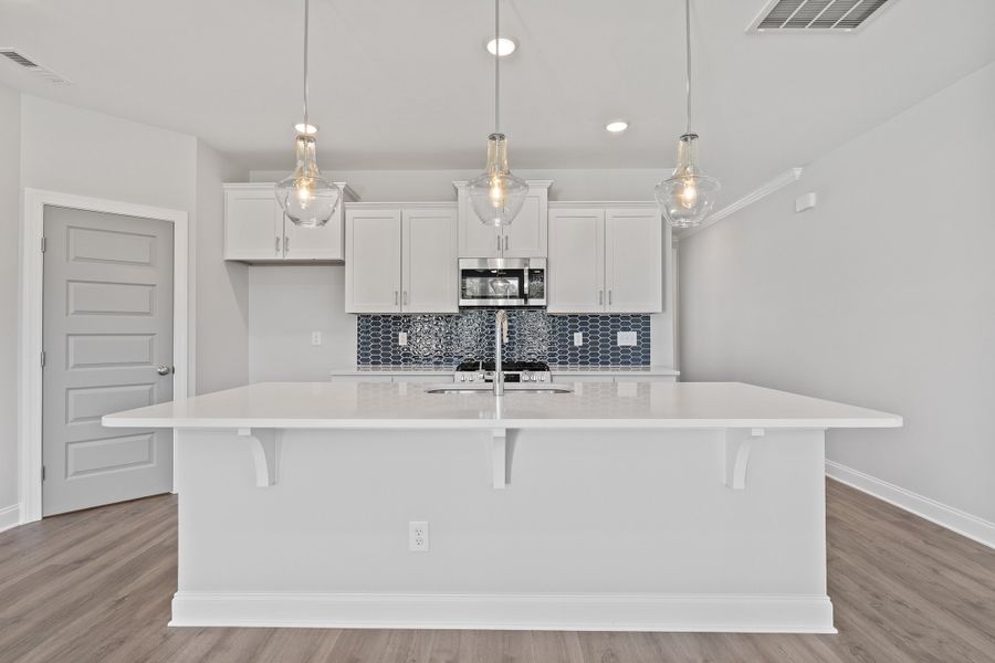 Representative furnished interior of a home built from the The Hemlock by RobuckHomes in Kennebec Crossing, Angier (Image 10).