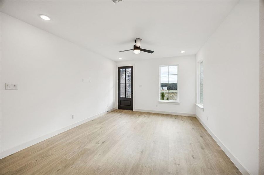 The light and bright family room is the perfect place to host friends and family!