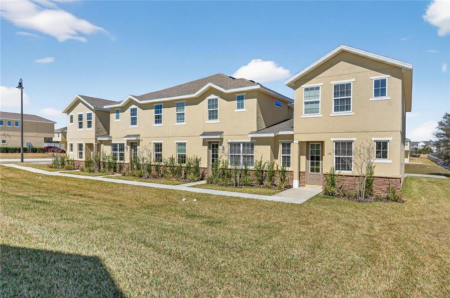 Front exterior of a new home in , Davenport, FL, highlighting curb appeal (Image 25).