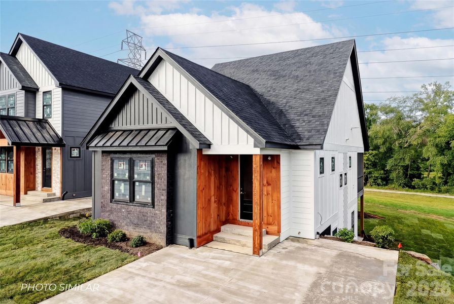 Front exterior of a new home in , Hendersonville, NC, highlighting curb appeal (Image 1). Front exterior of a new home in , Hendersonville, NC, highlighting curb appeal (Image 1).