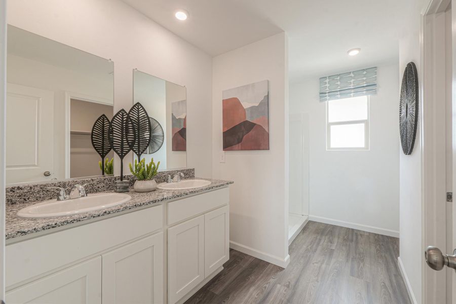 A bathroom with a marble countertop.