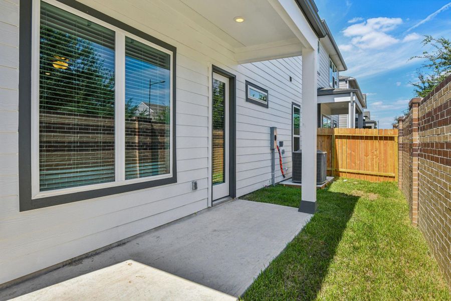 Exterior details and patio area of a home in Spring Brook Village - Luxe Series, Houston (Image 19).