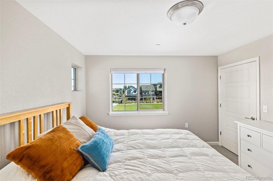 Primary bedroom overlooking the neighborhood park.