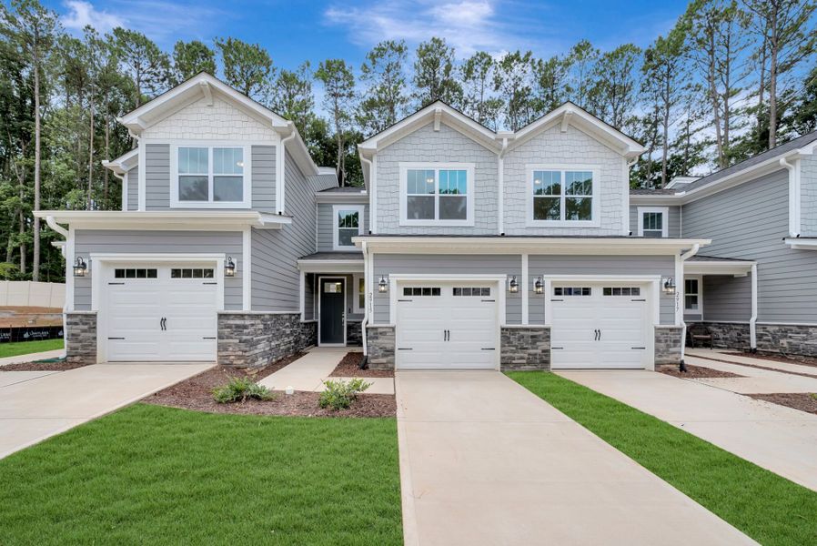 Front exterior of a new home in Ashmore Townes, Garner, NC, highlighting curb appeal (Image 2). Front exterior of a new home in Ashmore Townes, Garner, NC, highlighting curb appeal (Image 2).