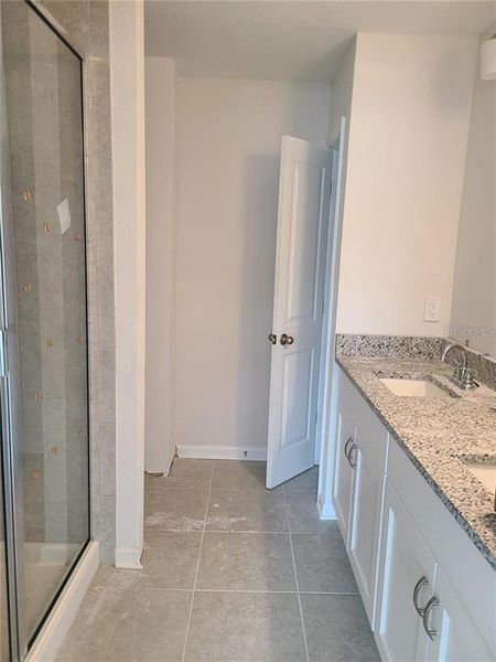 Master Bath with Double Vanity, Linen Closet, Shower (stock photo)