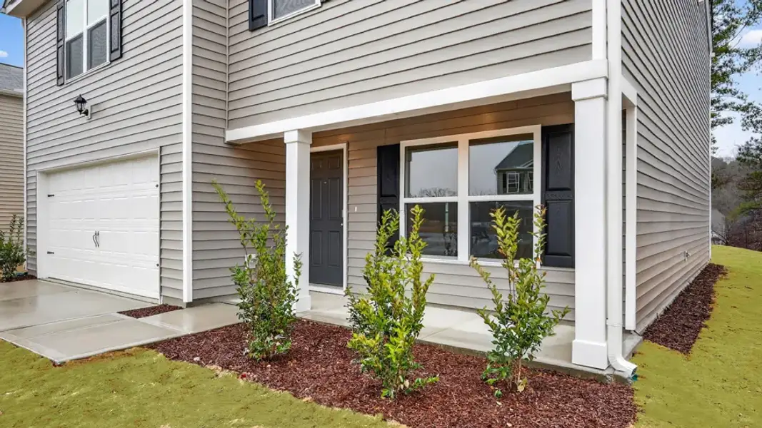 Exterior details and patio area of a home in Mangum Farms, Stem (Image 2).