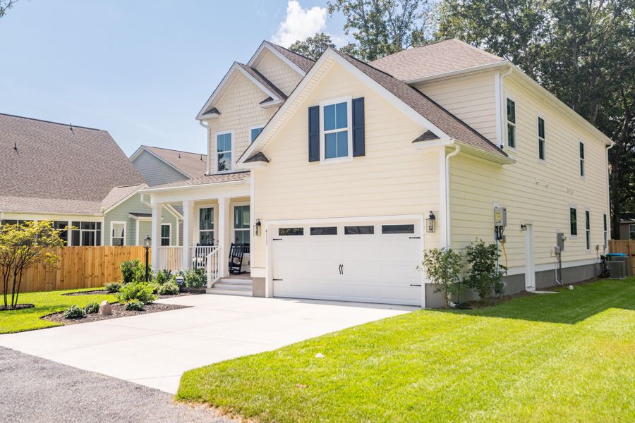 Front exterior of a new home in Overlook at Copahee Sound, Awendaw, SC, highlighting curb appeal (Image 1). Front exterior of a new home in Overlook at Copahee Sound, Awendaw, SC, highlighting curb appeal (Image 1).